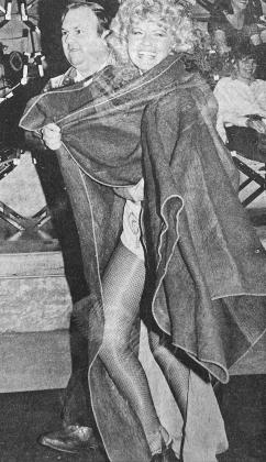 40 YEARS AGO Marching this suspect o_ the stage at the Southwest Playhouse following a raid was Custer County Undersheri_ Jim West. The suspect taken into custody was Joyce Winters (alias Tessie Tura.)