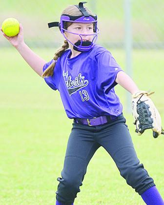Hydro-Eakly’s Ava Abbott focuses on her target, as she prepares to throw the ball during the Bobcats’ game against Lexington to open the OK Kids 8U Softball State Tournament Wednesday at Schumacher Fields at Acme Brick Park. CDN | Sam Goodwyn