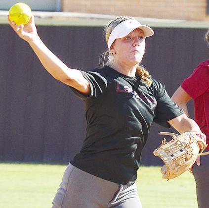 Stella Meacham hurls the ball to first during the final part of Clinton’s softball practice Thursday at the softball field. CDN | Sam Goodwyn
