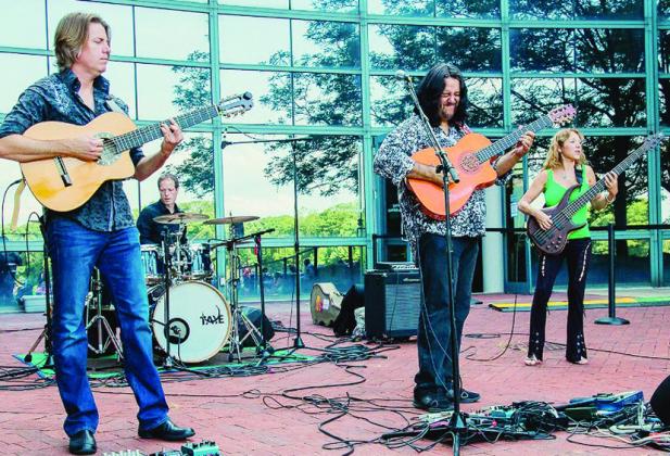 Pictured from left, guitarist Jim Stubblefield, drummer Timothy Curle, guitarist Jean Pierre Durand, and bassist Liza Carbé of the band Incendio set to perform at the Levitt AMP Clinton Music Series Friday at 7:30 p.m. at the R.A “Dick” Lloyd Amphith