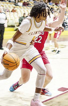 No. 1 DJ Lister drives the baseline to find an opening during Clinton’s win over Elgin Tuesday. CDN | Sam Goodwyn