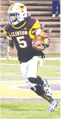 Clinton’s Jesus Gutierrez carries the ball against the Douglass Trojans in the final regular season game. CDN | Micah Ashcraft