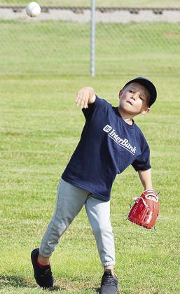 Harrlyn Graves throws the ball during one of his Noon Lions Club T-Ball games this season at Schumacher Fields at Acme Brick Park. CDN |Sam Goodwyn