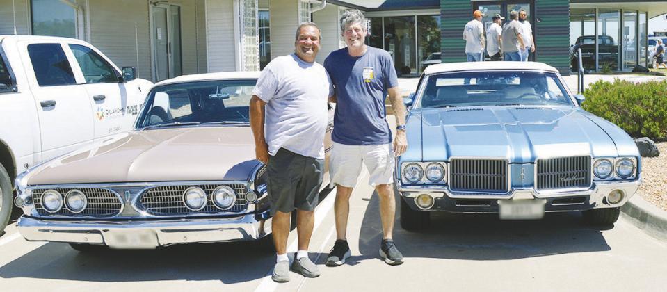 Daniel Patnode, left, with his 1960 Edsel Ranger and Dan Friedberg with his 1970 Oldsmobile Cutlass Supreme SX visit the Route 66 Museum Wednesday while on the “Main Street of America” Centennial Caravan. CDN | Christian Jacobsen