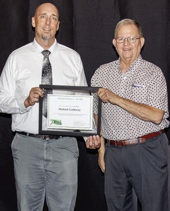 Jesse Beck, chair of the Oklahoma Floodplain Manager’s Association, presents Michael Galloway with the 2025 Chairperson’s Award. CDN | Courtesy photo