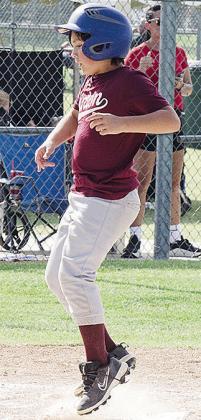 Hudson Burnam comes home to score a run during Clinton’s game Thursday against Chickasha in the first round of the OK Kids 8U Baseball Tournament. CDN | Sam Goodwyn