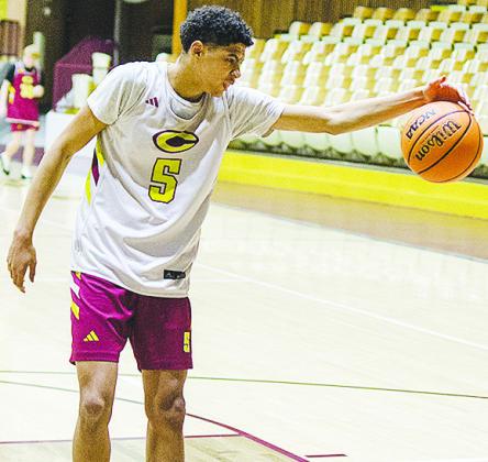 Clinton’s Kyron Forrest grabs the ball before it gets away from him during practice in the Tornado Dome. CDN | Sam Goodwyn