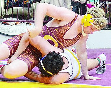 Marcus Wilson tries to roll his opponent from Hobart over in order to pin him during last weekend’s Hub City Wrestling Tournament in the Tornado Dome. CDN | Sam Goodwyn