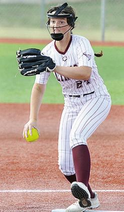 Clinton’s Brinley Taylor pitches from the circle during the Lady Reds’ game against Elk City Monday. CDN | Sam Goodwyn