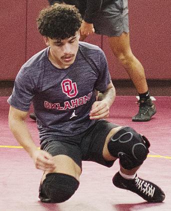 Clinton’s Tristan Cardenas works on his movements during wrestling practice. CDN | Sam Goodwyn