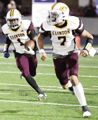 No. 7 Easten Powell leads No. 1 Derren Hester down the field as he carries the ball in Clinton’s road game Friday against Bridge Creek. CDN | John Kinsey