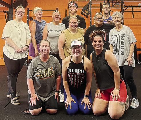 A recent crossfit class is all smiles after completing a workout at the Resolute Gym. Pictured kneeling, from left, are Melissa Gordon, Amy Hyde and Reagan Calvert; second row, Morgan Sprague, Heather Harding, Lori Green, Kelli Oliver, Mary Oliver and Cat