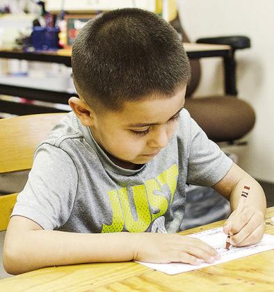 Adriel Martinez works on a Martin Luther King Jr. coloring page at Eastside Academy to celebrate Black History Month. CDN | Sam Goodwyn
