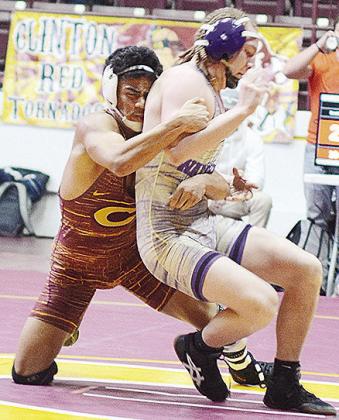 Clinton’s Tyson Brookter takes his opponent to the mat during the district duals at the Tornado Dome. CDN | Sam Goodwyn