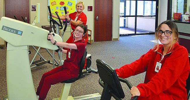 Nurse Tech Brianna Bowers, left, RN, BSA Jina Kilpatrick, back, and CNA Janie Arnett show off the