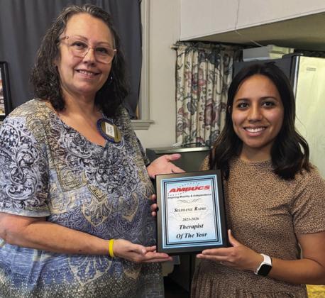 Clinton Chapter President of AMBUCS Misty Crider, left, presents Stephanie Radke with the 2025-2026 Therapist of the Year Award during the AMBUCS annual banquet held at Café Clinton. CDN | Courtesy photo