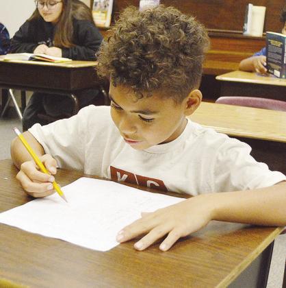 Jerimiah Wise practices his multiplication tables.