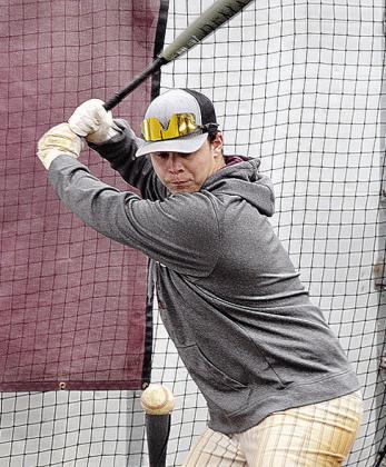 Reds senior baseball player Brady Chittum focuses on the ball during a hitting exercise at a recent practice. CDN | Sam Goodwyn