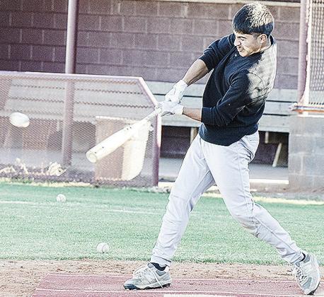 Jesus Gutierrez smacks the ball in hitting drills during practice Thursday at the baseball field. CDN | Sam Goodwyn