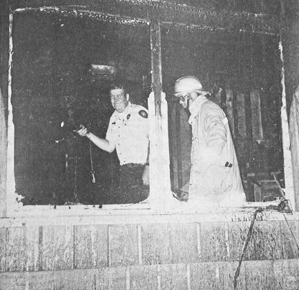 40 YEARS AGO Probing through charred embers looking for evidence of arson were Lt. J.D. Lafleur and Capt. Leon Kinder of the Clinton Fire Department. The location was an unoccupied mobile home at the west edge of Clinton.