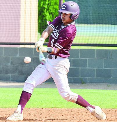 Clinton’s No. 5 Jesus Gutierrez swings at the incoming pitch during the Reds’ home win Thursday over Thomas. CDN | Sam Goodwyn