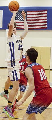 CBA’S Travis Cooke rises above his opponent to take a shot during the Crusaders’ game Friday against Sharon-Mutual. CDN | Sam Goodwyn