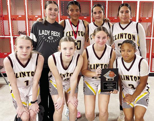 Clinton’s eighth-grade girls’ basketball team takes a team photo after finishing as runner-up in the Yukon Tournament last weekend. Pictured, from left, in front are Destiny Krewall, Hannah Miller, Sydnee Pugh and Ale-Jia Lacy; back, Quincy Matlock, V