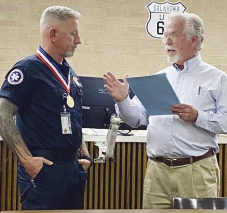 Sinor’s Jason Lambeth, left, is honored with a proclamation from Mayor David Berrong. CDN | Staff Photo
