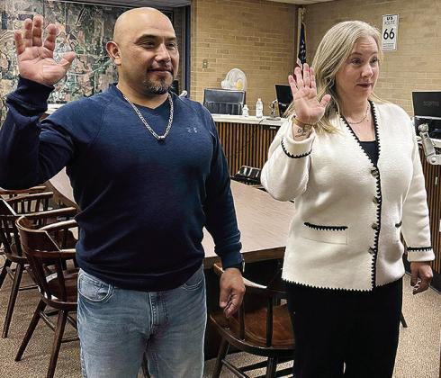 Ernesto Villanueva, left, and Erin Adams are sworn in to their new terms on the Clinton City Council before Tuesday night’s meeting. CDN | Courtesy photo