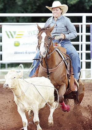 Rebekah Davis is all focus as she tightens the rope around the cow’s neck in the breakaway roping event during the Clinton Round-up Club’s rodeo Saturday in the Clinton Round-up Arena. CDN | Sam Goodwyn