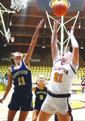 Clinton’s Rhylee Rodebush shoots the ball over a Kingfisher defender Saturday during the district round of the Class 4A Basketball Tournament at the Tornado Dome. CDN | Sam Goodwyn