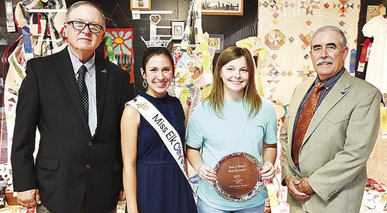 From left, Oklahoma Wheat Commissioners Chairman Raymond Parrish, Miss Elk City Teen Bailey Gossen, Arapaho-Butler’s Malley Baker and David Gammill recognize Baker’s champion tray for winning “Best of Wheat” bread making contest at the Oklahoma St