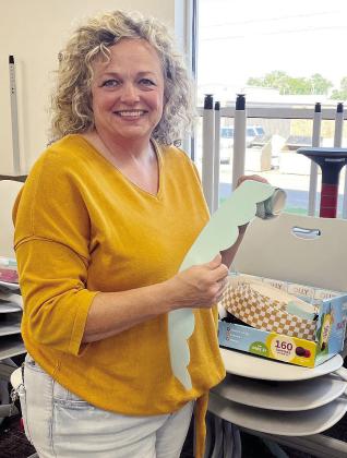 Southwest Elementary teacher Ginger England boxes up bulletin board border in her classroom Friday morning to officially close out her 2025 spring semester. CDN | Courtesy photo