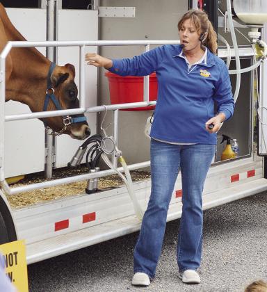 Suzie Reece teaches a group of students about dairy cows in a mobile dairy classroom during the Custer County Free Fair. CDN | Micah Ashcraft