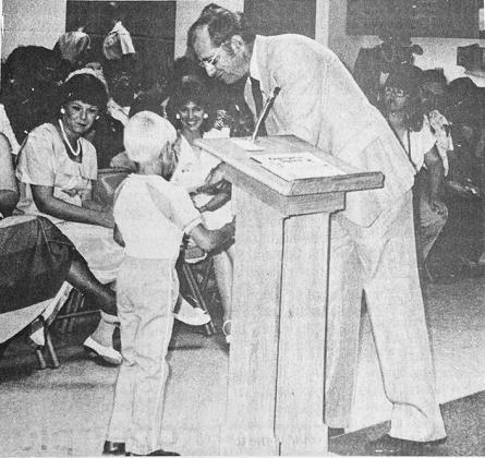 40 YEARS AGO Jeremey Lamar received his kindergarten diploma from Nance School principal Farris Brookman while parents and teachers look on.