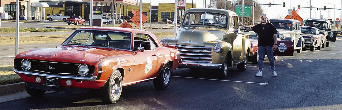 America’s Automotive Trust Communications Director Jake Welk steps out of just one of the several classic vehicles in a caravan stopping at the Oklahoma Route 66 Museum while traveling the entire length of Route 66 ahead of the car’s display at the De