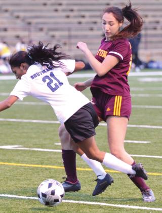 Clinton sophomore forward Ali Rodelo fights for the ball