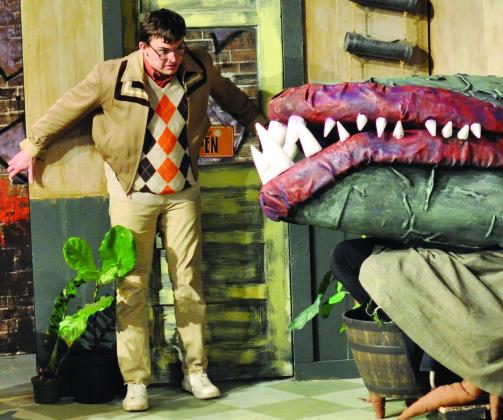 Seymour Krelborn (Wesley Javorsky) reacts to hearing Audrey II (voiced by Nathan Devaughn).