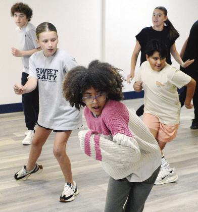 Spark Project students practice out the dance moves for the song “A Little More Homework” from the play “13: The Musical” at The Spark Project on Frisco. Students from left are Alex Stratton, Tinlee Chase, Huyler Christensen, Christian Hensley, and Lily Adkinson. CDN | Christian Jacobsen