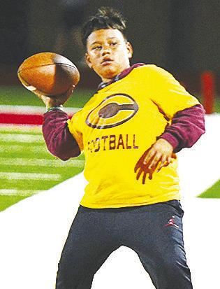 Kai Jefferson throws the football on the sideline during halftime of Clinton’s road game last week against Cache. CDN | Sam Goodwyn