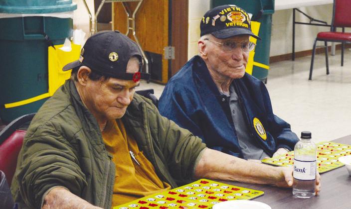 George G. Goret, left, and David Mitchell are playing bingo at the Clinton Veterans Center. Mitchell completed a bingo on the immediate next number called. CDN | Christian Jacobsen