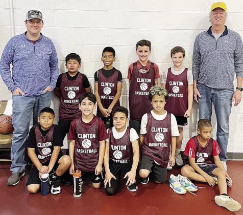 The Clinton third-grade basketball team poses to take a team photo. Pictured, front from left, are Jacob Guzman, Sebastian Ringo, Jaelynn Lee, Mehkai Ford and Anthony Bennett; back, Coach Kent Jaggers, Jarod Moss, Jessiah Reed, Copeland Flaming, Greyson J