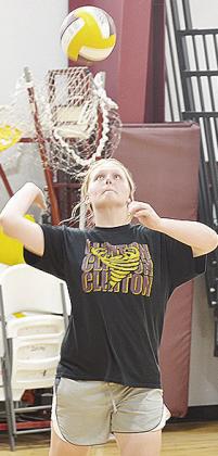 Clinton’s Sammi Hammans focuses on the ball as she prepares to serve it during practice Tuesday in the practice gym. CDN | Sam Goodwyn