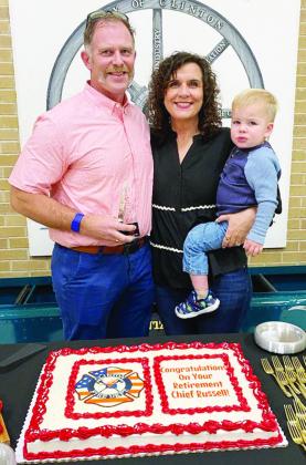 Recently retired Clinton Fire Chief Brett Russell was feted with an award and cake at Tuesday’s Clinton City Council meeting. Joining him are his wife Marci and his grandson Sam Calvert. CDN | Staff Photo