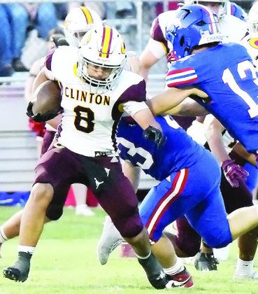 Clinton’s Jaden Potter avoids a Chandler defender during the Red Tornadoes’ road game Friday against the Lions. CDN | John Kinsey