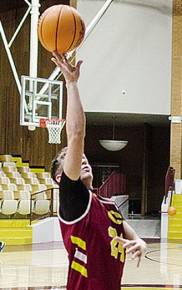 Clinton’s Wes Switzer goes up for a layup during practice in the Tornado Dome. CDN | Sam Goodwyn