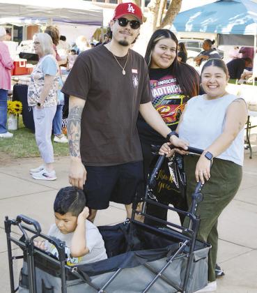 This family is walking around the Farmers Market to see what foods they have available. Pictured from left is Jeremiah Hernandez, Luis Hernandez, America Borjas, and Victoria Hernandez.