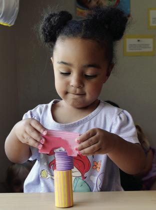 Nora Jefferson shows off her block balancing skills recently at Kingdom Kids Family Child Care at Western Oklahoma Christian School. CDN | Christian Jacobsen