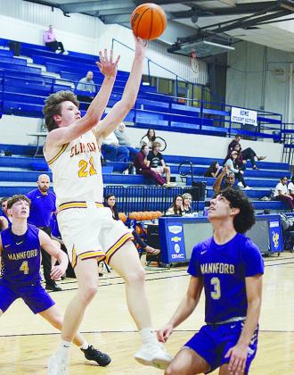 Clinton’s Ayden Crumley shoots the ball over a Mannford player during the Red Tornadoes’ road playoff Thursday game against the Pirates in Kingfisher. CDN | Sam Goodwyn