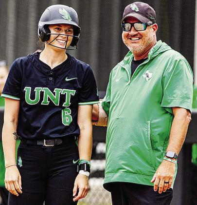 University of North Texas Coach Jon Hunter, right, chats with Elizabeth Moffitt during a game. UNT Athletics
